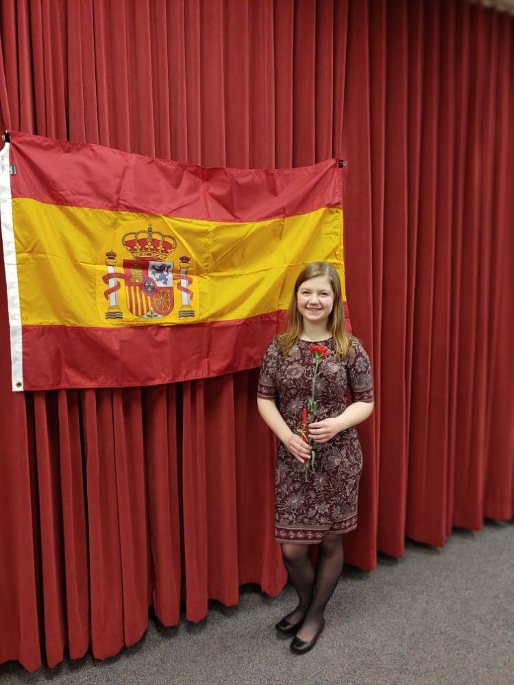 Megan Kruskie posing in front of Spanish flag